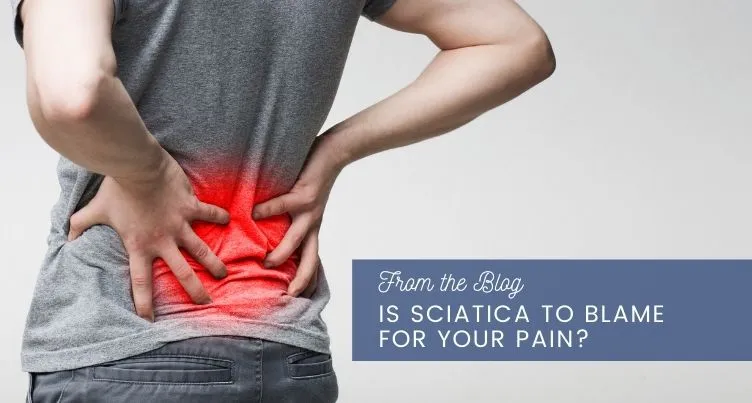 Man grabbing back in pain.