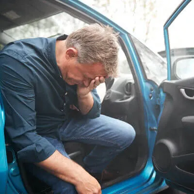 Upset man in wreck
