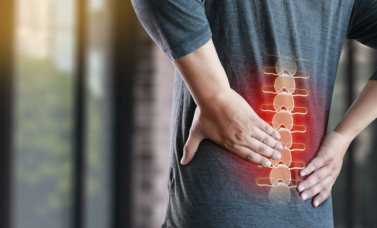 man having a lower back pain from pinched nerve