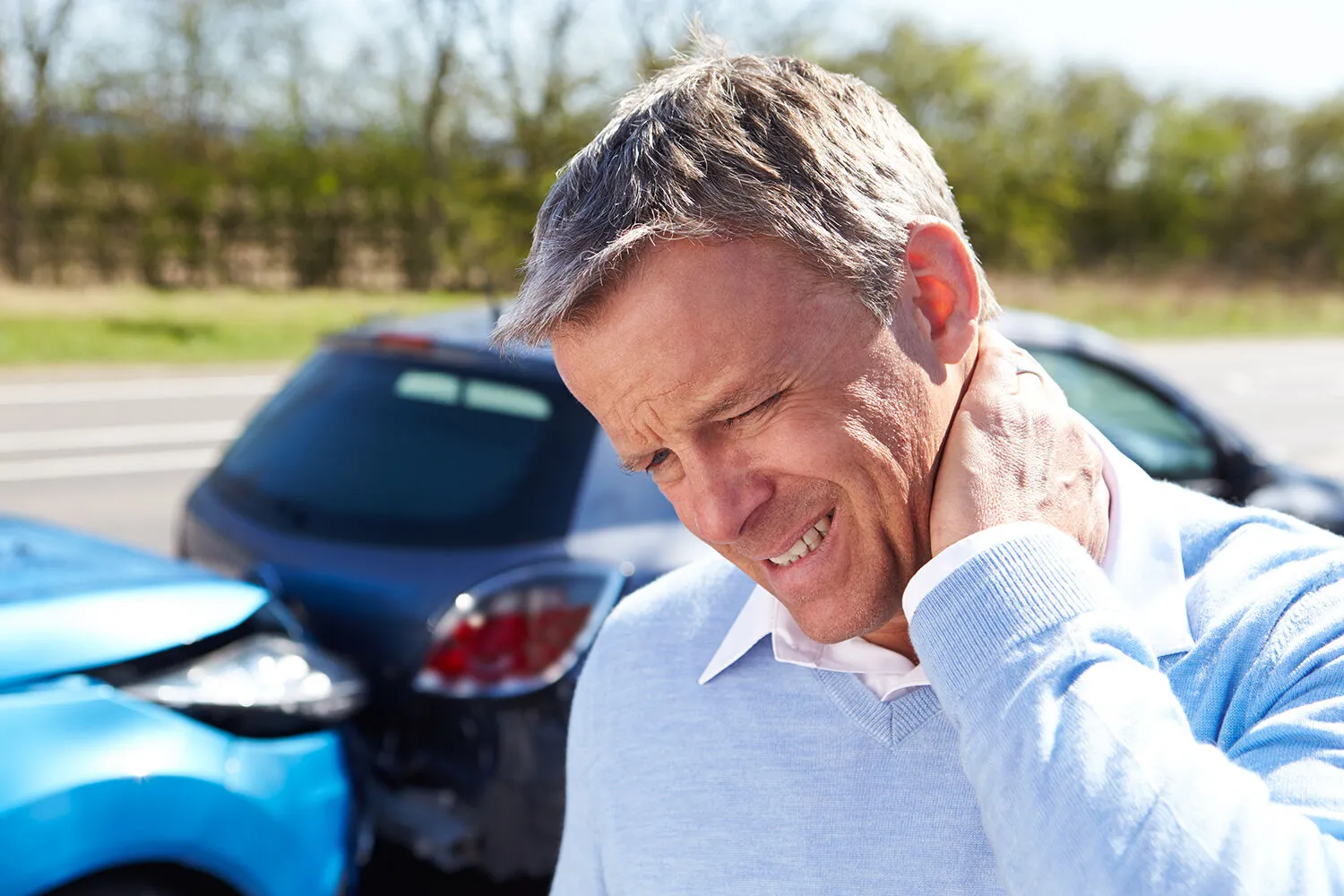 man suffering whiplash after car accident